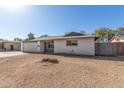 Single-story home exterior featuring a low-maintenance front yard and attached garage at 1859 E Gemini Dr, Tempe, AZ 85283