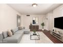 Bright living room featuring contemporary decor, a comfortable sofa, and stylish accents at 1859 E Gemini Dr, Tempe, AZ 85283