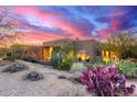 Southwestern style home with desert landscaping, purple cactus and vibrant sunset at 30600 N Pima Rd # 49, Scottsdale, AZ 85266