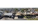 An aerial view of a quaint neighborhood featuring cozy homes and lush greenery at 3133 W Polk St, Phoenix, AZ 85009