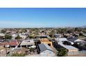 A scenic aerial perspective of a charming community, highlighting rooftops and tree canopies at 3133 W Polk St, Phoenix, AZ 85009