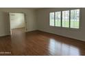 Bright living room featuring hardwood floors and ample natural light at 511 W Ocotillo Rd, Phoenix, AZ 85013