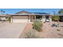 Charming single-Gathering home with well-manicured lawn, desert landscaping and solar panels on the roof at 516 E Gemini Dr, Tempe, AZ 85283