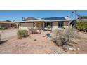 Single-Gathering home with low maintenance desert landscaping, palm trees, and solar panels on the roof at 516 E Gemini Dr, Tempe, AZ 85283