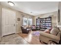 Inviting living room featuring tile flooring, neutral colors, and ample natural light at 6523 S 34Th Dr, Phoenix, AZ 85041