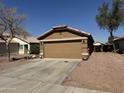Picture of a two-car garage of a charming single-story home with desert landscaping at 12046 W Scotts Dr, El Mirage, AZ 85335