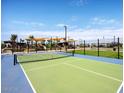 Active lifestyle community with a pickleball court and playground for outdoor recreation at 20897 S 231St Pl, Queen Creek, AZ 85142