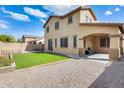 A low maintenance backyard with small grass area, covered patio and gravel at 21366 E Alyssa Rd, Queen Creek, AZ 85142