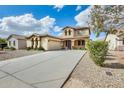 Charming two-story home features desert landscaping and a long, paved driveway at 21366 E Alyssa Rd, Queen Creek, AZ 85142