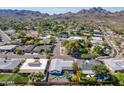 Overhead view of property with mountain views and well-maintained landscaping at 2818 E Malapai Dr, Phoenix, AZ 85028
