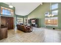 Bright living room with high ceilings, multiple windows, and a leather sofa, offering a welcoming space at 4617 E Montgomery Rd, Cave Creek, AZ 85331