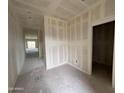 Unfinished room with bare walls, concrete floor, and doorway leading to another space at 47734 W Moeller Rd, Maricopa, AZ 85139