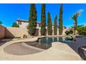 Inviting backyard pool surrounded by mature trees and a privacy wall at 6350 S Wilson Dr, Chandler, AZ 85249