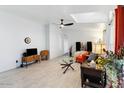 Sun-lit living room featuring modern furniture, ceiling fan and tiled flooring at 6960 W Peoria Ave # 29B, Peoria, AZ 85345