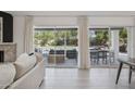 Open living area with large sliding doors, neutral colors, tile floors and outdoor access at 10524 E Cannon Dr, Scottsdale, AZ 85258