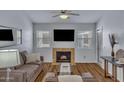Comfortable living room with a fireplace, TV, and stylish decor at 14145 N 92Nd St # 2046, Scottsdale, AZ 85260