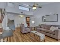 Inviting living room with a ceiling fan, comfortable seating, and stairs leading to an upper level at 14145 N 92Nd St # 2046, Scottsdale, AZ 85260