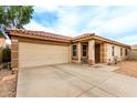 Charming single-story home featuring a low-maintenance front yard, two-car garage and covered porch at 1557 S Halsted Dr, Chandler, AZ 85286
