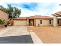 Charming single-story home featuring a low-maintenance front yard, two-car garage and covered porch at 1557 S Halsted Dr, Chandler, AZ 85286