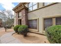 Exterior corner shot of the building, showcasing desert landscaping at 19700 N 76Th St # 1124, Scottsdale, AZ 85255