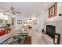 Bright, open-concept living room with fireplace, tile floors, and seamless flow to the rest of the home at 19700 N 76Th St # 1124, Scottsdale, AZ 85255