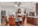Eat-in kitchen featuring dark wood cabinets, granite countertops, stainless steel appliances, and natural light at 2321 N Glenview --, Mesa, AZ 85213