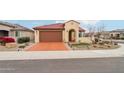 Inviting single-story home with a spacious driveway, low-maintenance desert landscaping, and a two-car garage at 27467 W Osprey Dr, Buckeye, AZ 85396