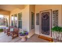 Inviting porch with seating area, decorative accents, and a welcoming entrance at 3285 E Phelps St, Gilbert, AZ 85295