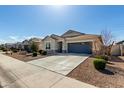 Inviting single-story home with a spacious driveway and low maintenance landscaping at 37783 W San Sisto Ave, Maricopa, AZ 85138