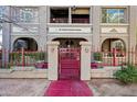 View of entrance with security gate showing the building number, 387, and a red walkway at 387 N 2Nd Ave # 2E, Phoenix, AZ 85003