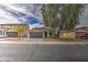 Attractive single-story home with a two-car garage, desert landscaping, and easy access to nearby streets at 44715 W Paitilla Ln, Maricopa, AZ 85139