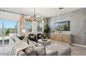 Inviting living area with stylish furniture, decorative lighting, and large sliding glass doors at 5771 E Axle Ln, San Tan Valley, AZ 85140