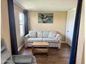 Relaxing living room features a sofa, accent table, and neutral tones for a serene space at 7750 E Broadway Rd # 433, Mesa, AZ 85208