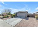 Well-maintained home featuring a concrete driveway and desert landscaping at 797 W Danish Red Trl, San Tan Valley, AZ 85143