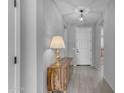 Bright hallway featuring wood-look flooring and decorative lighting at 797 W Danish Red Trl, San Tan Valley, AZ 85143