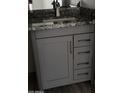 Bathroom vanity with grey cabinet, granite countertop and sleek hardware at 8101 N 107Th Ave # 26, Peoria, AZ 85345