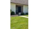 Charming townhome front entrance with well manicured green grass at 8101 N 107Th Ave # 26, Peoria, AZ 85345