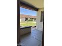 View from a porch of manicured lawn and adjacent townhomes at 8101 N 107Th Ave # 26, Peoria, AZ 85345
