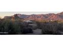 View of property with desert landscaping, mountain view, trees, and cacti at 9736 E Sleepy Hollow Trl, Gold Canyon, AZ 85118