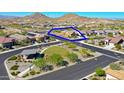 Beautiful aerial shot of a home in a well-planned community offering mountain views and an attractive layout at 16788 W Beth Dr, Goodyear, AZ 85338
