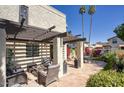 Inviting outdoor patio featuring a pergola, comfortable seating, and lush landscaping at 1803 E Hayward Ave # 1, Phoenix, AZ 85020