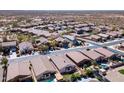 A desirable neighborhood features well-maintained homes, mature landscaping, and community streets at 18430 E Azul Ct, Gold Canyon, AZ 85118