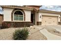 Charming single-story home with well-manicured landscaping and a two-car garage at 18430 E Azul Ct, Gold Canyon, AZ 85118