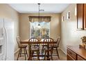 Cozy breakfast area with a window view, a table with seating for six, and neutral paint at 20148 N Big Dipper Dr, Maricopa, AZ 85138