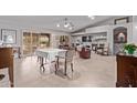 Open living room with neutral colors and tile floors at 2890 N 156Th Dr, Goodyear, AZ 85395