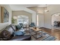 Bright living room with ample natural light, comfortable seating, and stylish decor, creating a welcoming atmosphere at 3116 W Folgers Rd, Phoenix, AZ 85027