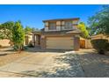 Charming two-story home with a neutral color palette, well-manicured landscaping and a two car garage at 3299 E Boston St, Gilbert, AZ 85295