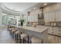 This bright kitchen offers a large island, stainless appliances, and a breakfast nook with bay windows at 3373 E Oriole Way, Chandler, AZ 85286