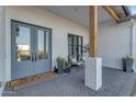 Inviting entrance to the home featuring double glass doors and brick pavers at 35150 N Bell Rd, Queen Creek, AZ 85144