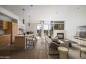 Bright living room featuring fireplace, floor-to-ceiling windows, and open floor plan at 4745 N Scottsdale Rd # 3008, Scottsdale, AZ 85251